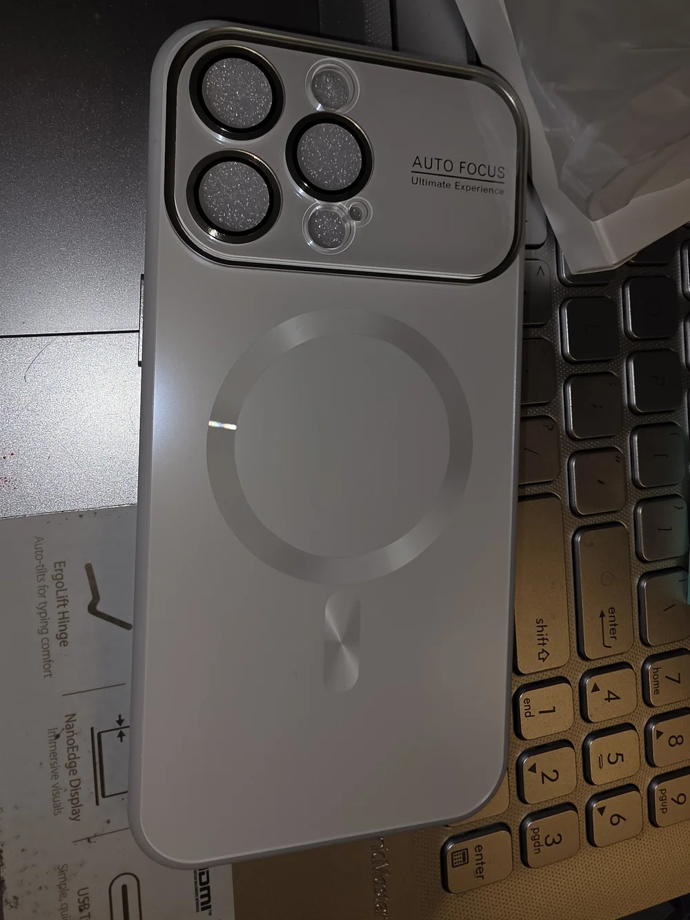 MagSafe-Compatible White Phone Case with Camera Ring and Auto Focus Detail